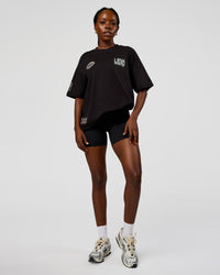 Woman wearing Static Grit Heavyweight Oversized Tee - Black-Alloy | Model:Ellie | Size:XS | Thumbnail Index: 8