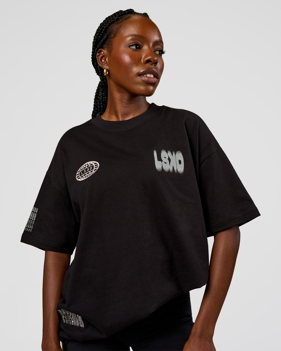 Woman wearing Static Grit Heavyweight Oversized Tee - Black-Alloy | Model:Ellie | Size:XS - view 4