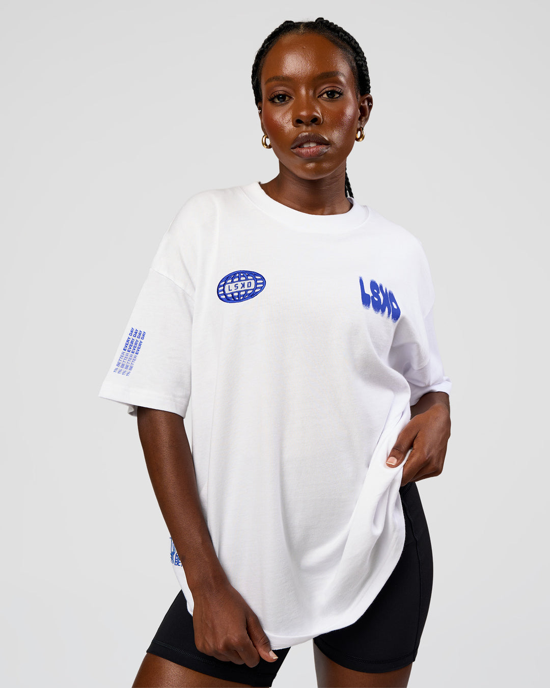 Woman wearing Static Grit Heavyweight Oversized Tee - White-Electric Indigo | Model:Ellie | Size:XS - view 4