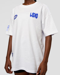 Woman wearing Static Grit Heavyweight Oversized Tee - White-Electric Indigo | Model:Ellie | Size:XS | Thumbnail Index: 8