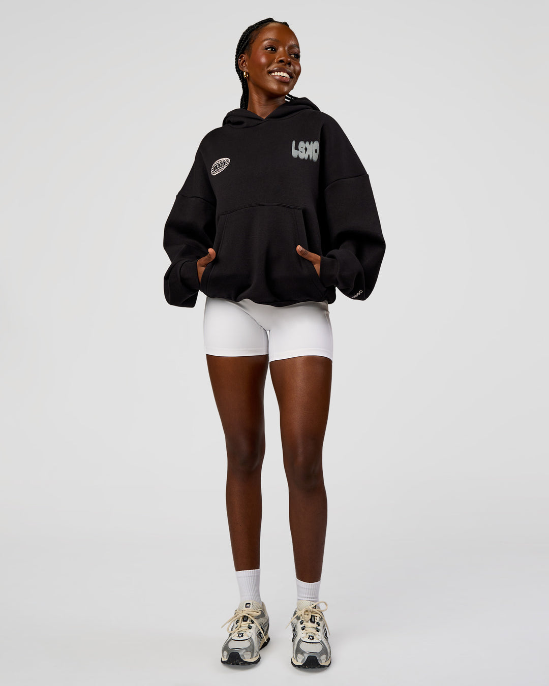 Woman wearing Static Grit Unisex Boxy Hoodie - Black-Alloy | Model:Ellie | Size:XS - view 5