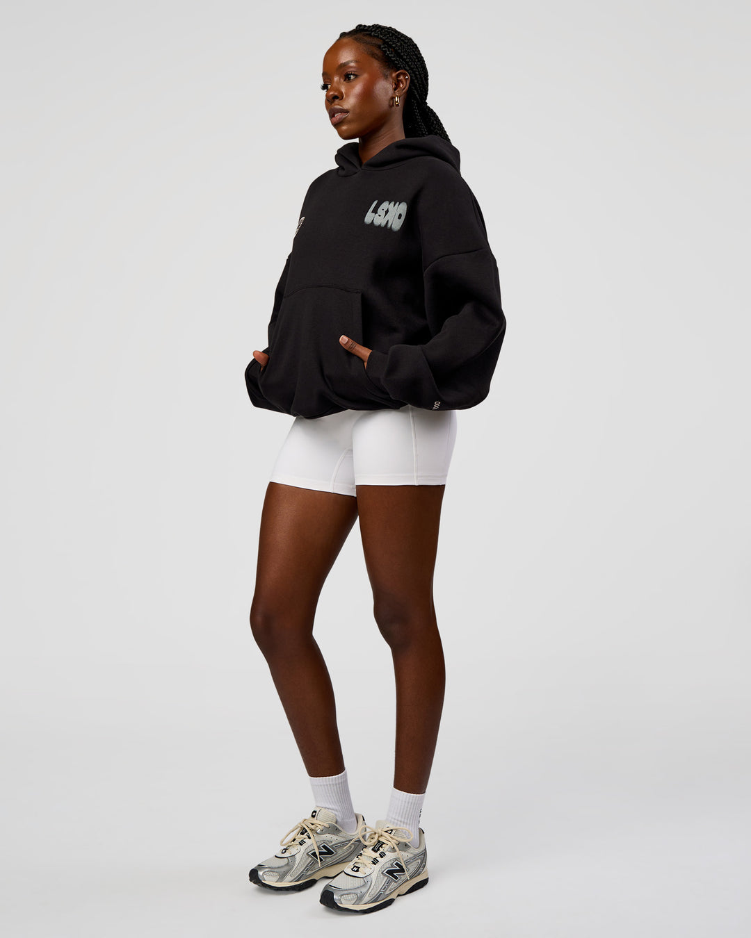 Woman wearing Static Grit Unisex Boxy Hoodie - Black-Alloy | Model:Ellie | Size:XS - view 9