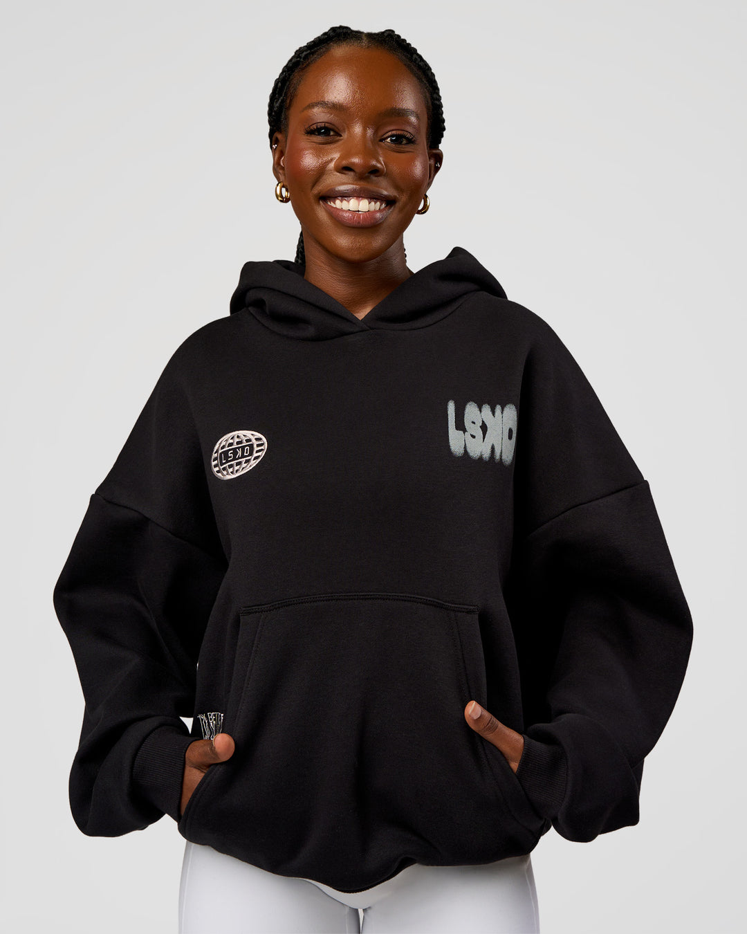 Woman wearing Static Grit Unisex Boxy Hoodie - Black-Alloy | Model:Ellie | Size:XS - view 4