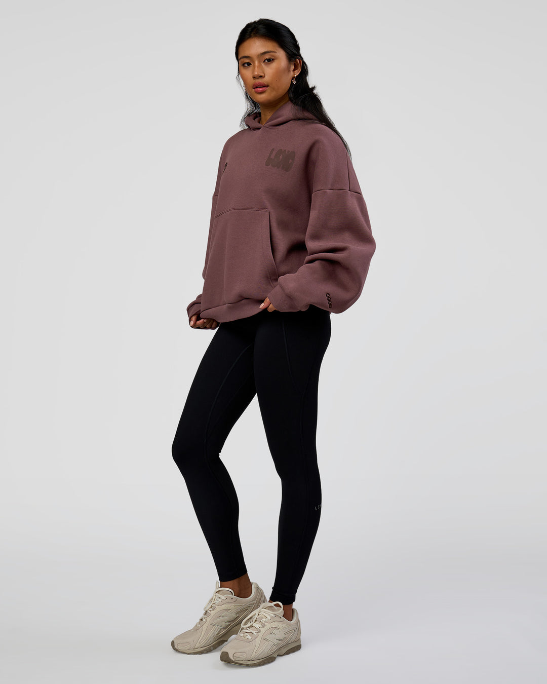 Woman wearing Static Grit Unisex Boxy Hoodie - Cocoa Powder-Hot Chocolate | Model:Loren | Size:XS - view 14