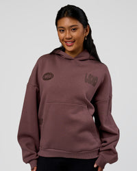 Woman wearing Static Grit Unisex Boxy Hoodie - Cocoa Powder-Hot Chocolate | Model:Loren | Size:XS | Thumbnail Index: 3