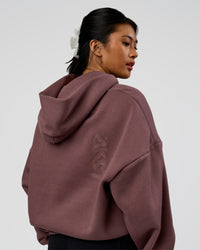 Woman wearing Static Grit Unisex Boxy Hoodie - Cocoa Powder-Hot Chocolate | Model:Loren | Size:XS | Thumbnail Index: 4