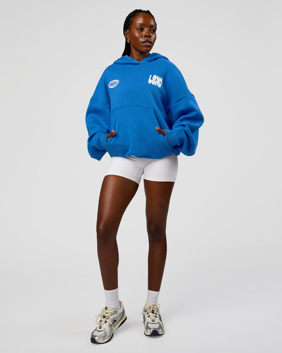 Woman wearing Static Grit Unisex Boxy Hoodie - Palace Blue-White | Model:Ellie | Size:XS - view 10
