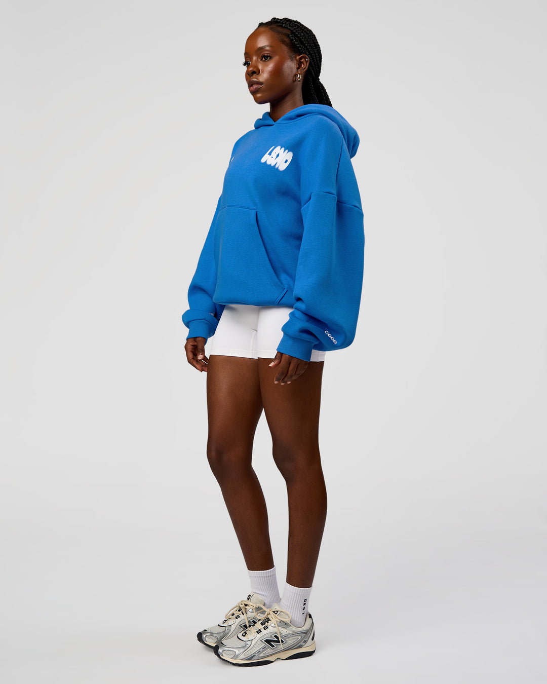 Woman wearing Static Grit Unisex Boxy Hoodie - Palace Blue-White | Model:Ellie | Size:XS - view 13