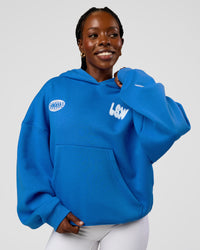 Woman wearing Static Grit Unisex Boxy Hoodie - Palace Blue-White | Model:Ellie | Size:XS | Thumbnail Index: 4