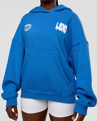 Woman wearing Static Grit Unisex Boxy Hoodie - Palace Blue-White | Model:Ellie | Size:XS | Thumbnail Index: 10