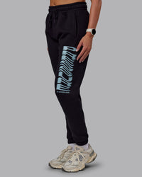 Woman wearing Static Track Pant - Black-Skyride | Model:Phoebe | Size:XS | Thumbnail Index: 1