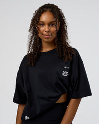 Woman wearing Sticker Heavyweight Oversized Tee - Black-White | Model:Jordan | Size:XS | Thumbnail Index: 3
