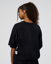 Woman wearing Sticker Heavyweight Oversized Tee - Black-White | Model:Jordan | Size:XS | Thumbnail Index: 10