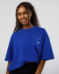 Woman wearing Sticker Heavyweight Oversized Tee - Electric Indigo-Baltic Sea | Model:Jordan | Size:XS | Thumbnail Index: 3