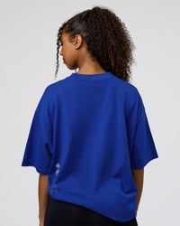 Woman wearing Sticker Heavyweight Oversized Tee - Electric Indigo-Baltic Sea | Model:Jordan | Size:XS | Thumbnail Index: 4