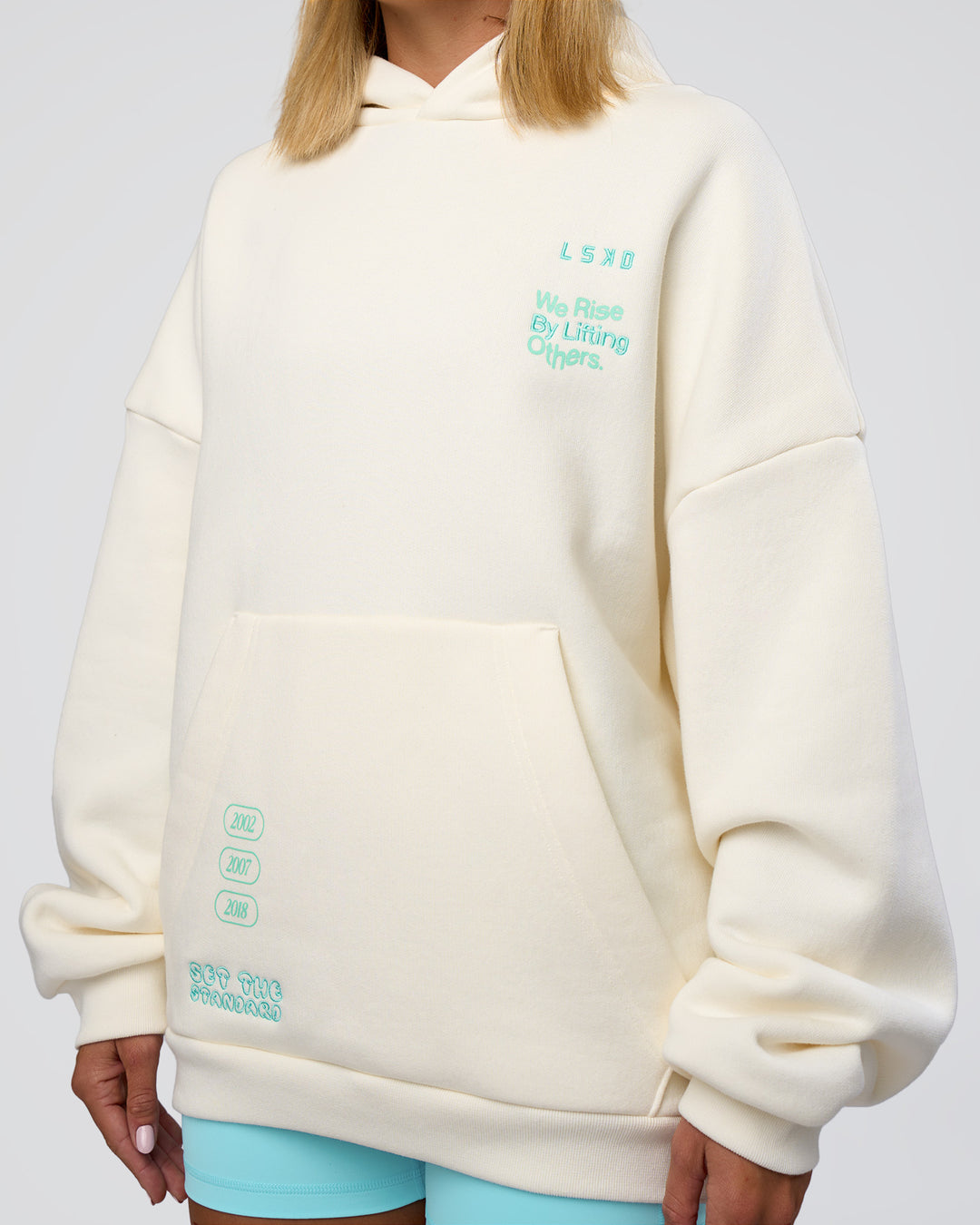 Woman wearing Sticker Unisex Oversized Hoodie - Off White-Jelly Mint | Model:Amity | Size:XS - view 14