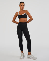 Woman wearing Tempo Sports Bra - Black-White | Model:Brylee | Size:XS | Thumbnail Index: 4