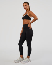 Woman wearing Tempo Sports Bra - Black-White | Model:Brylee | Size:XS | Thumbnail Index: 2
