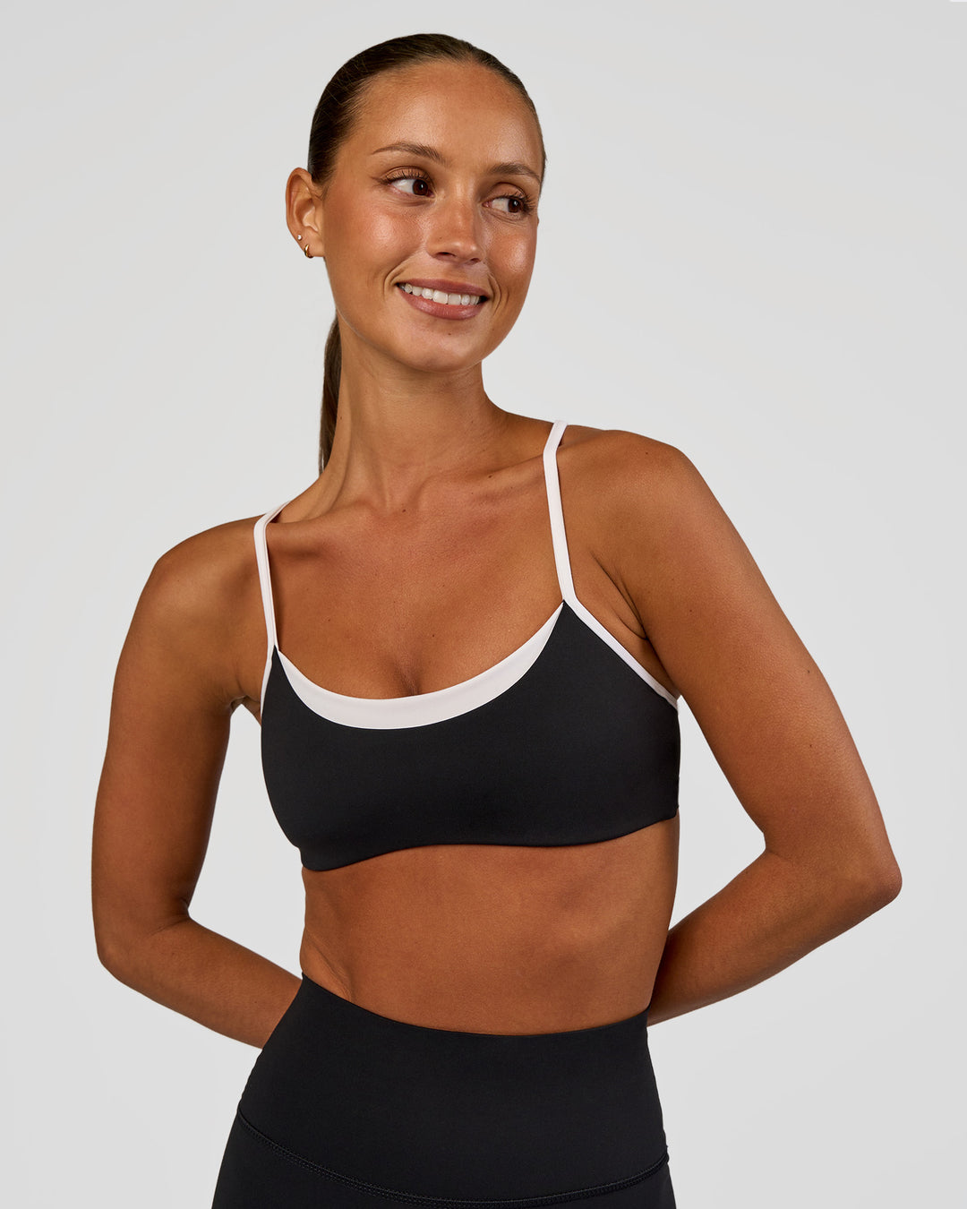 Woman wearing Tempo Sports Bra - Black-White | Model:Brylee | Size:XS - view 1