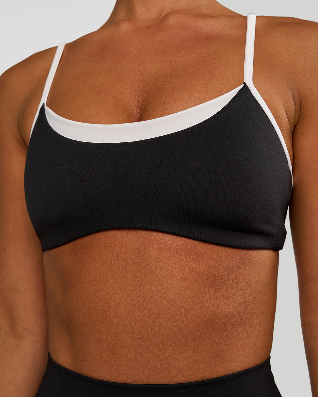 Woman wearing Tempo Sports Bra - Black-White | Model:Brylee | Size:XS - view 4