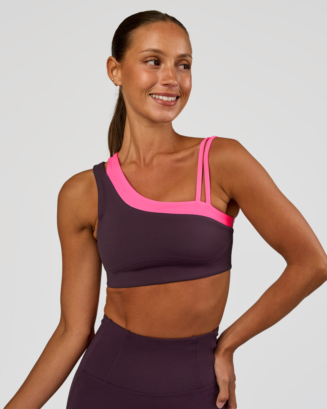 Woman wearing Thrive Asymmetric Sports Bra - Midnight Plum-Sugar Plum | Model:Brylee | Size:XS - view 4