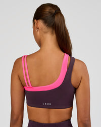 Woman wearing Thrive Asymmetric Sports Bra - Midnight Plum-Sugar Plum | Model:Brylee | Size:XS | Thumbnail Index: 7