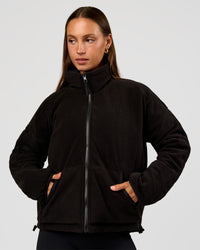 Woman wearing Thrive Reversible Jacket - Black | Model:Brylee | Size:XS | Thumbnail Index: 5
