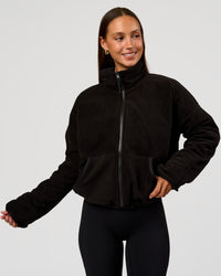 Woman wearing Thrive Reversible Jacket - Black | Model:Brylee | Size:XS | Thumbnail Index: 1