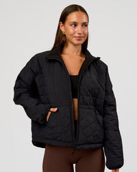 Woman wearing Thrive Reversible Jacket - Black | Model:Brylee | Size:XS | Thumbnail Index: 0