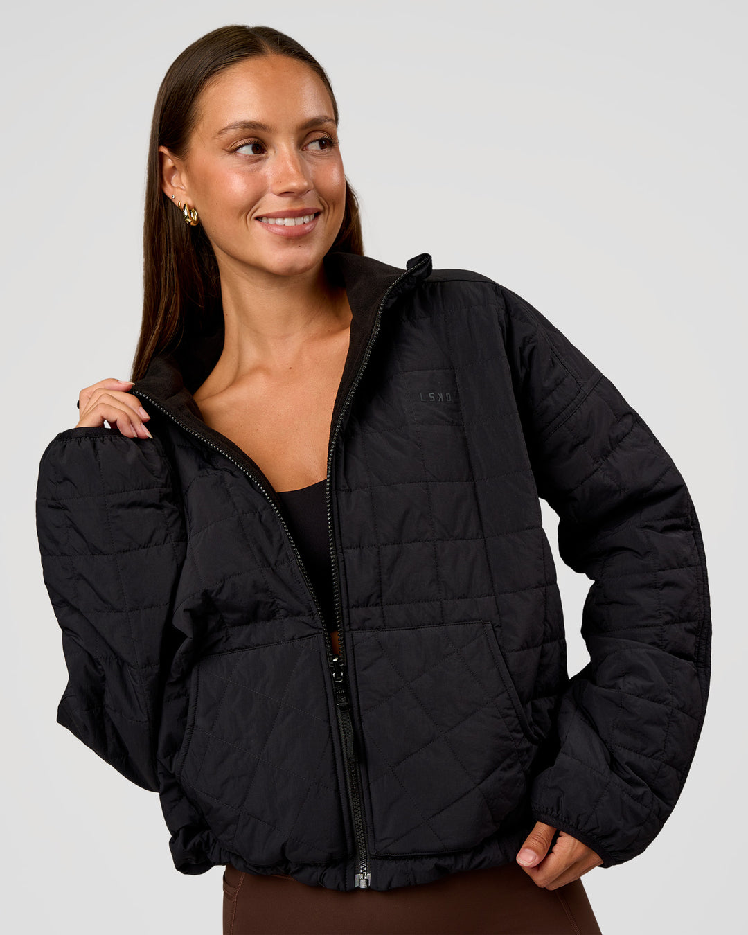 Woman wearing Thrive Reversible Jacket - Black | Model:Brylee | Size:XS - view 9