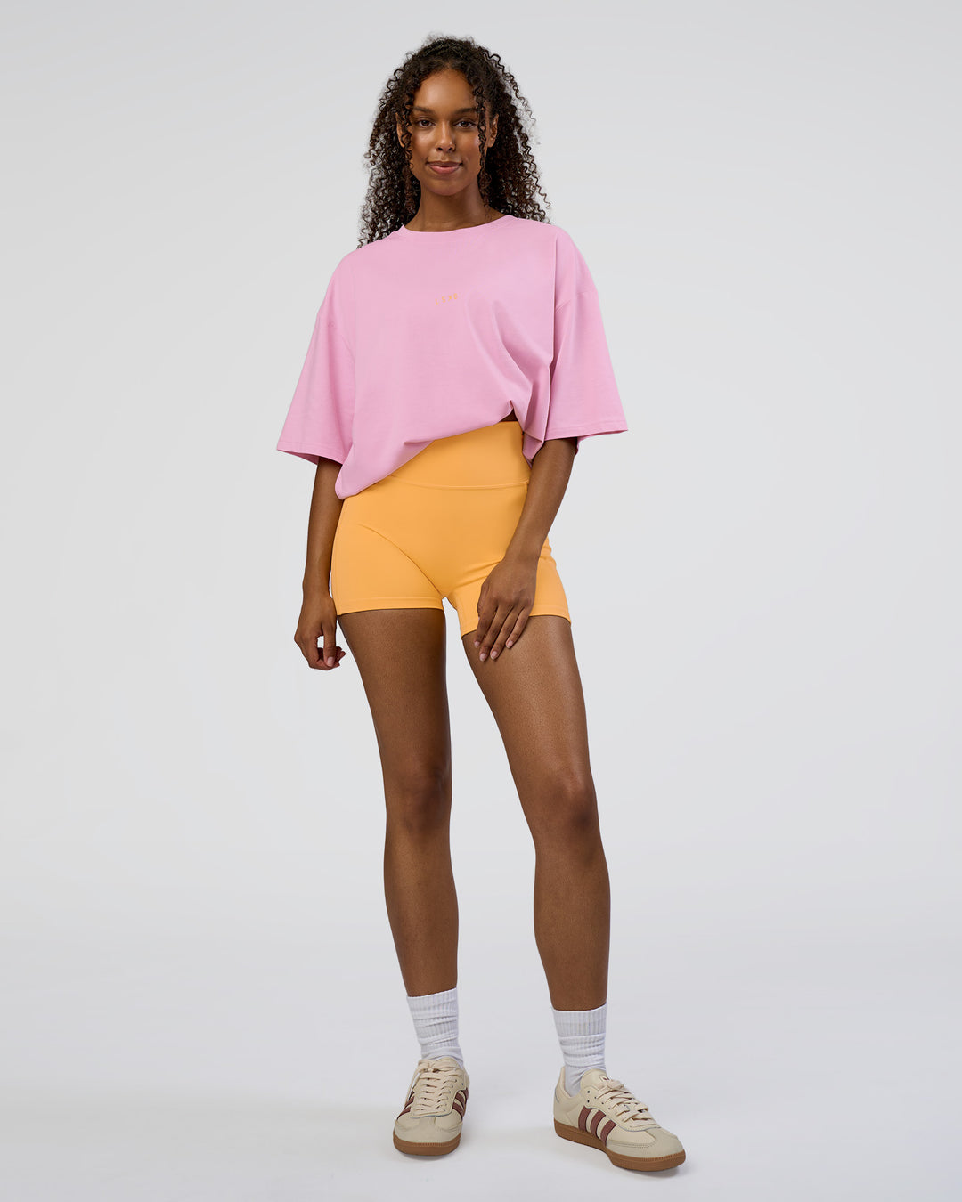 Woman wearing Together We Rise FLXCotton Oversized Tee - Bubblegum-Warm Apricot | Model:Jordan | Size:L - view 6