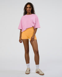 Woman wearing Together We Rise FLXCotton Oversized Tee - Bubblegum-Warm Apricot | Model:Jordan | Size:L | Thumbnail Index: 5
