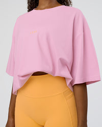 Woman wearing Together We Rise FLXCotton Oversized Tee - Bubblegum-Warm Apricot | Model:Jordan | Size:L | Thumbnail Index: 7