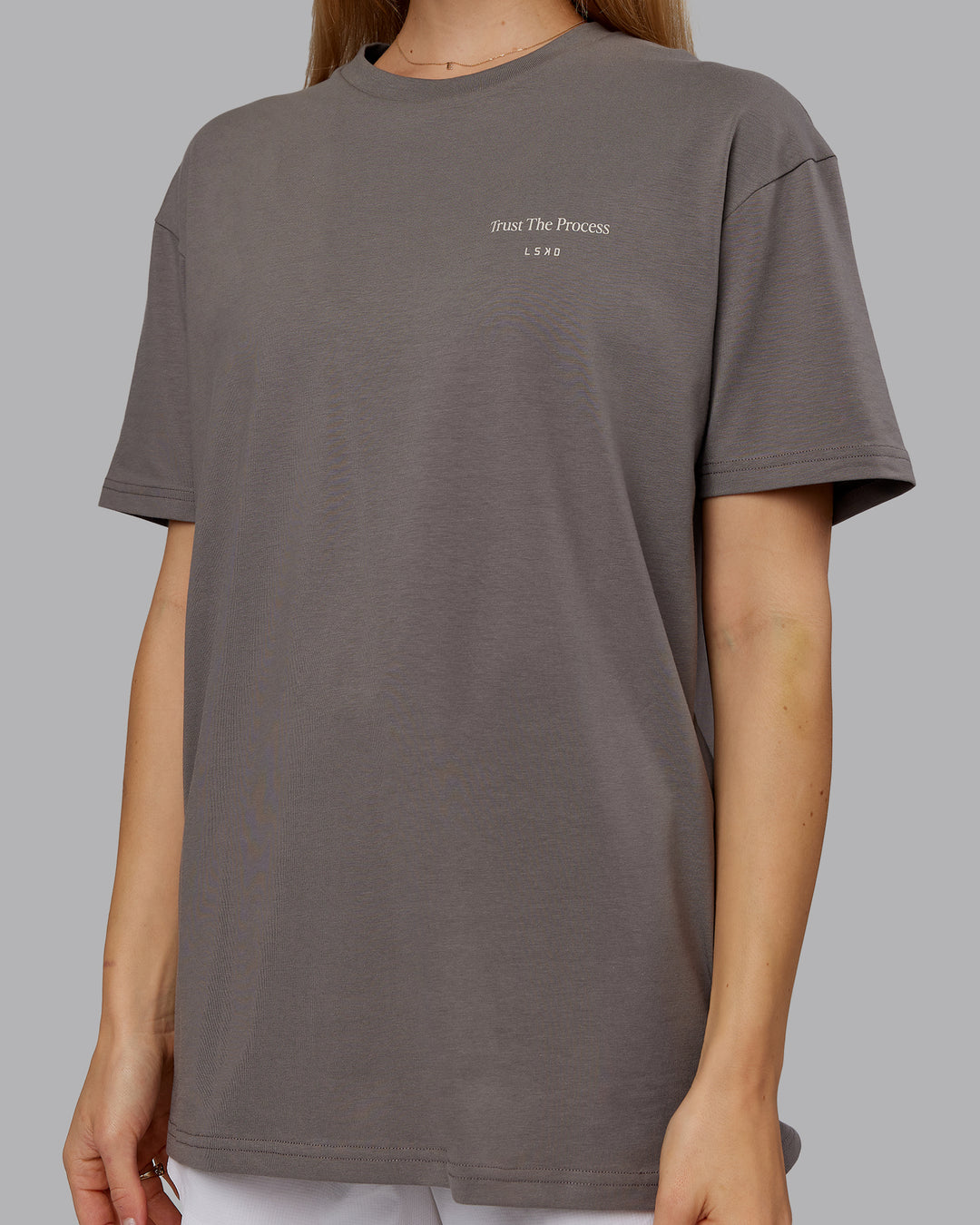 Woman wearing Trust The Process 2.0 FLXCotton Tee Oversize - Storm Front-Shale Beige | Model:Emilie | Size:XS - view 8