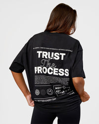 Woman wearing Trust The Process Heavyweight Unisex Oversized Tee - Black-White | Model:Kirstyn | Size:XS | Thumbnail Index: 3