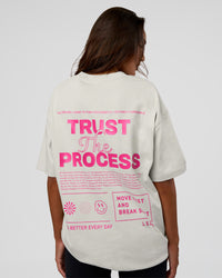 Woman wearing Trust The Process Heavyweight Unisex Oversized Tee - Digital Mist-Ultra Pink | Model:Kirstyn | Size:XS | Thumbnail Index: 4