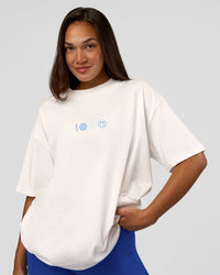 Woman wearing Trust The Process Heavyweight Unisex Oversized Tee - Off White-Electric Indigo | Model:Kirstyn | Size:XS | Thumbnail Index: 4