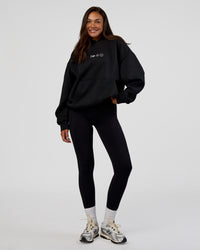 Woman wearing Trust The Process Unisex Oversized Hoodie - Black-White | Model:Kirstyn | Size:XS | Thumbnail Index: 7