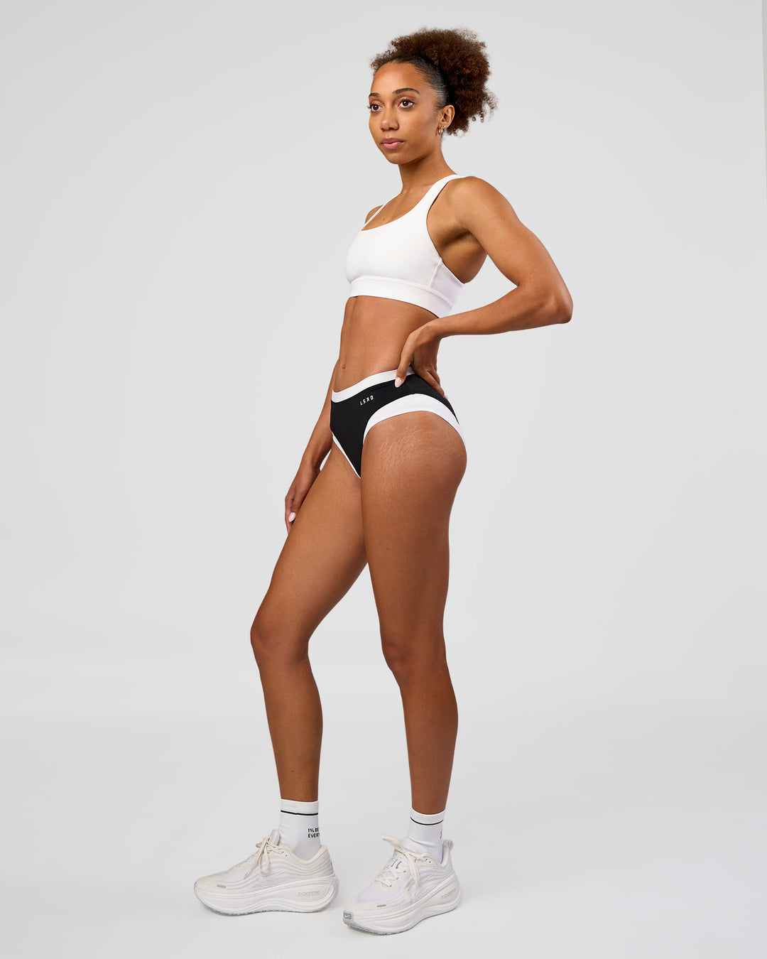 Woman wearing Turbo Track Brief in Black-White| Model:Txai | Size:XS - view 4