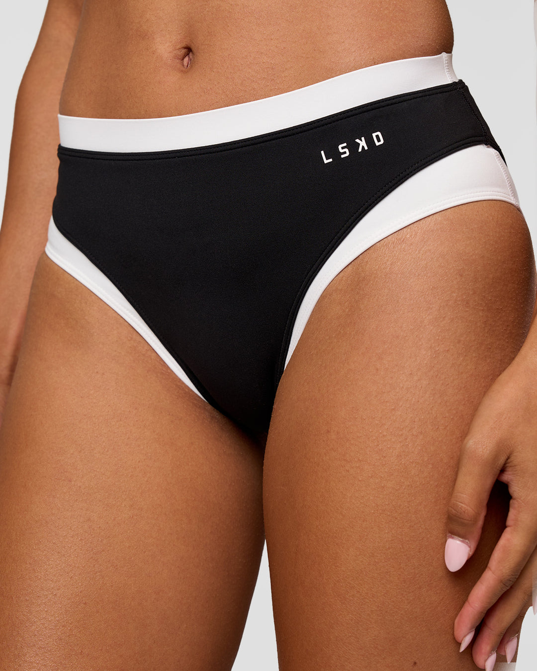 Woman wearing Turbo Track Brief in Black-White| Model:Txai | Size:XS - view 2