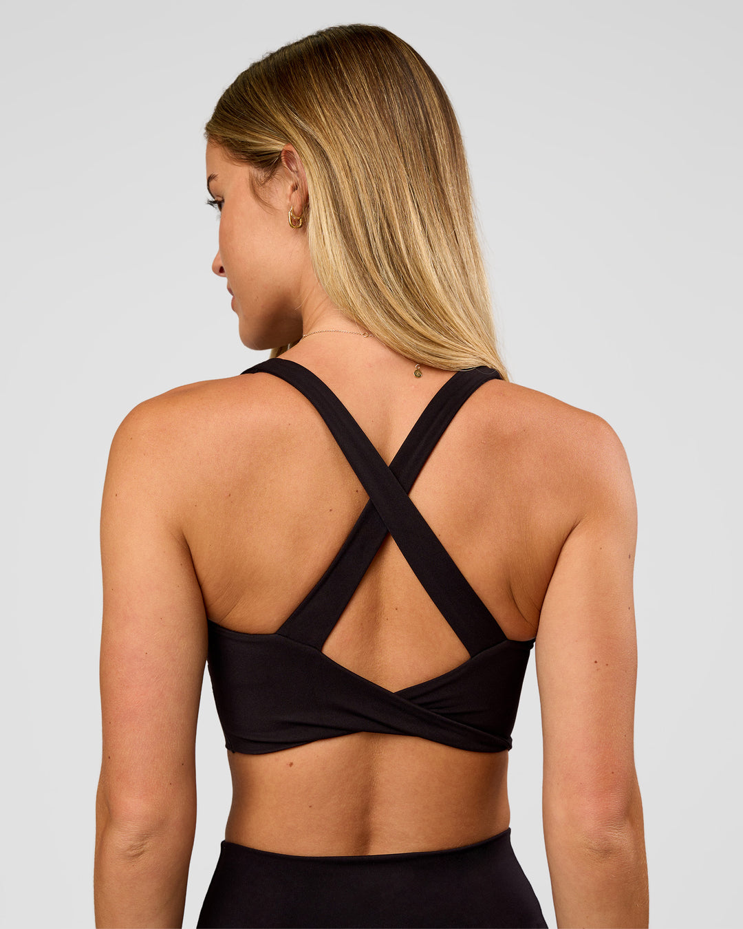 Woman wearing Twist Long Line Sports Bra in Black | Model:Issy | Size:XS - view 8