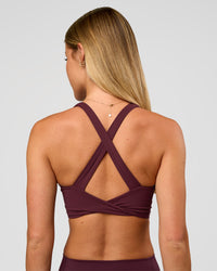 Woman wearing Twist Long Line Sports Bra in Cherry Lacquer | Model:Issy | Size:XS | Thumbnail Index: 6