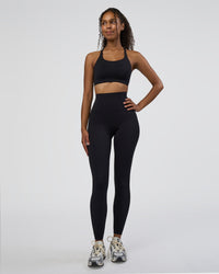 Woman wearing Twist Sports Bra D/DD/E - Black | Model:Jordan | Size:XS | Thumbnail Index: 2