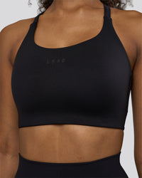 Woman wearing Twist Sports Bra D/DD/E - Black | Model:Jordan | Size:XS | Thumbnail Index: 6