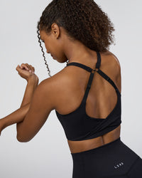 Woman wearing Twist Sports Bra D/DD/E - Black | Model:Jordan | Size:XS | Thumbnail Index: 0