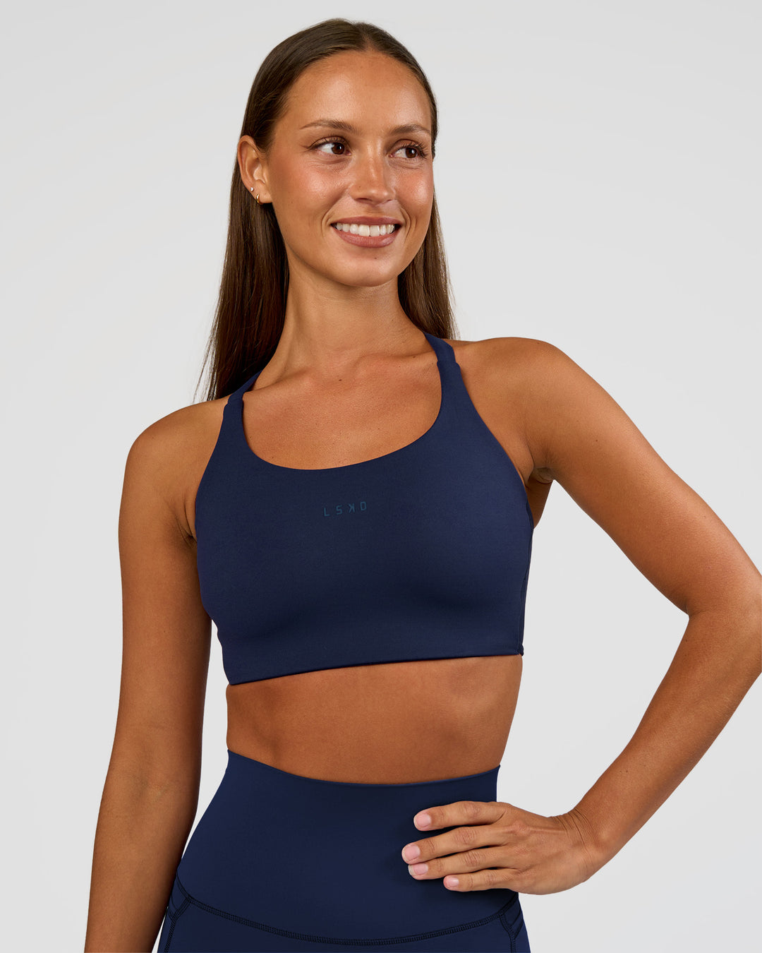 Woman wearing Twist Sports Bra D/DD/E - Future Navy | Model:Brylee | Size:XS - view 3