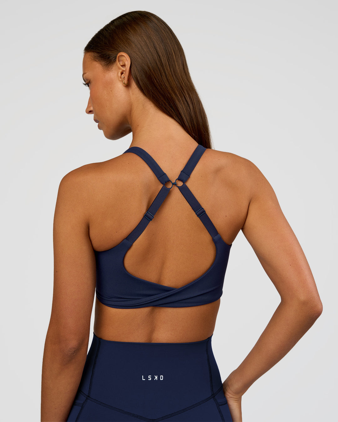Woman wearing Twist Sports Bra D/DD/E - Future Navy | Model:Brylee | Size:XS - view 1