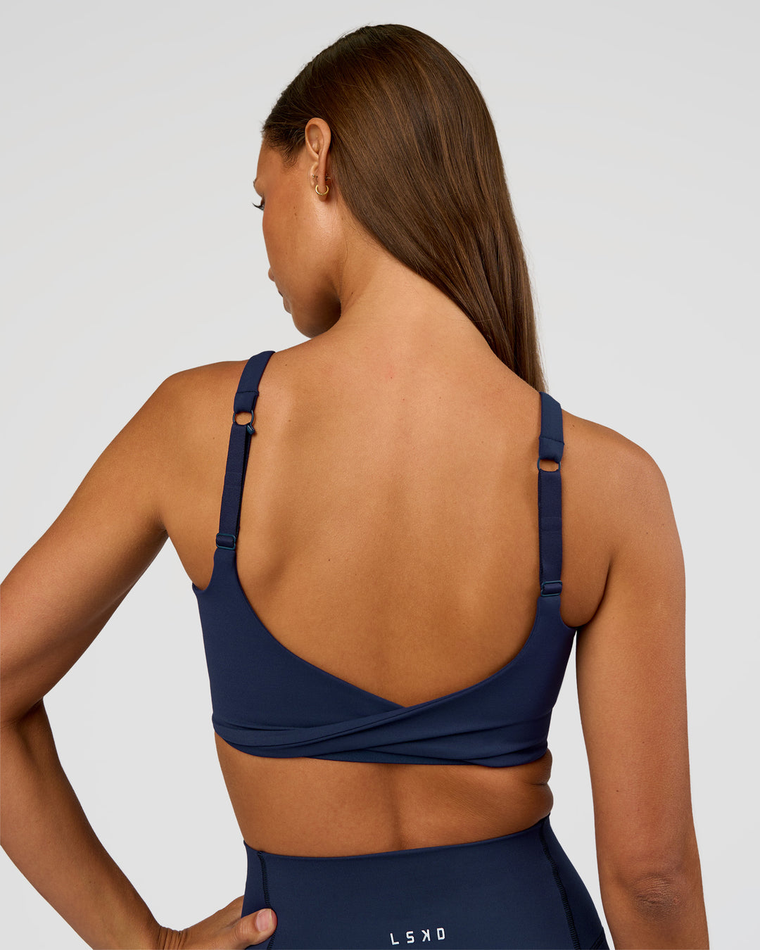 Woman wearing Twist Sports Bra D/DD/E - Future Navy | Model:Brylee | Size:XS - view 4