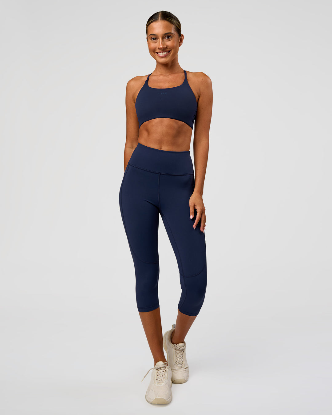 Woman wearing Twist Sports Bra - Future Navy | Model:Charli | Size:XS - view 4