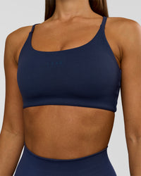 Woman wearing Twist Sports Bra - Future Navy | Model:Brylee | Size:XS | Thumbnail Index: 8